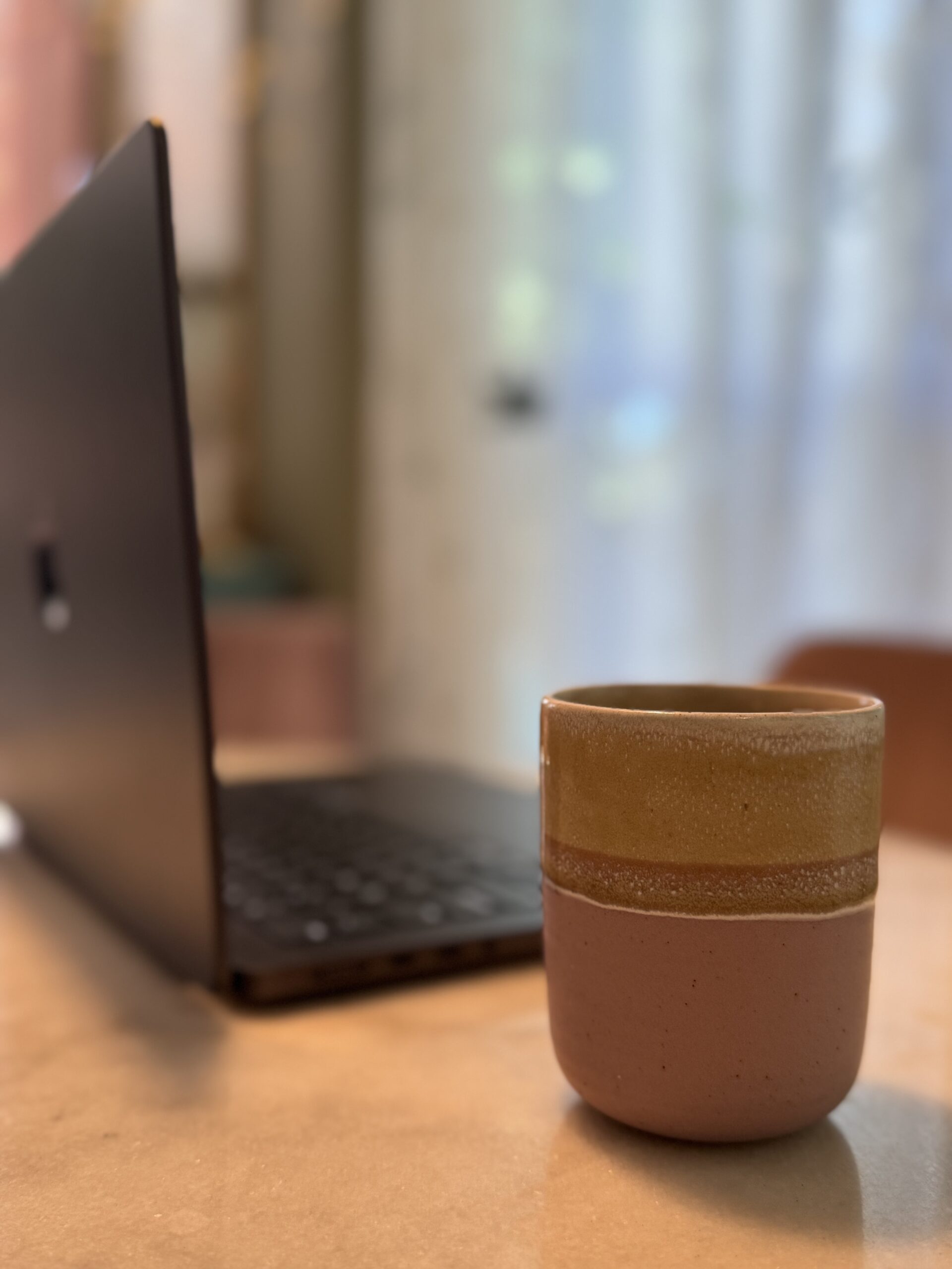 Photo of coffee by a laptop, Credit Kate Ristau